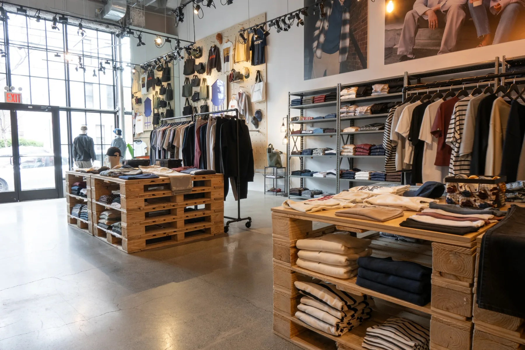 Folded collections and freestanding rails across the Brooklyn Industries retail floor.