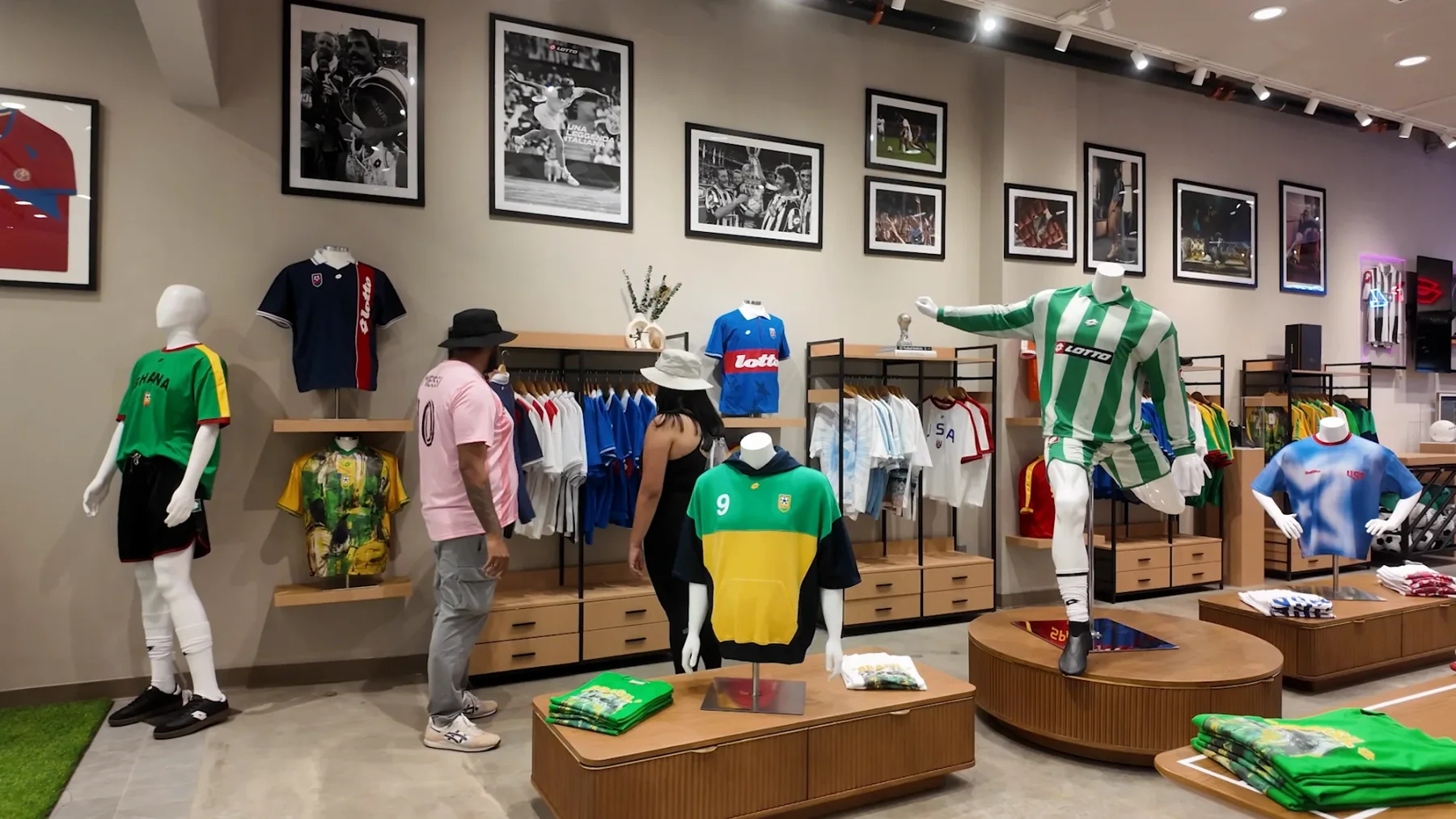 Timber merchandise displays, football jerseys and framed heritage photographs inside Lotto at American Dream