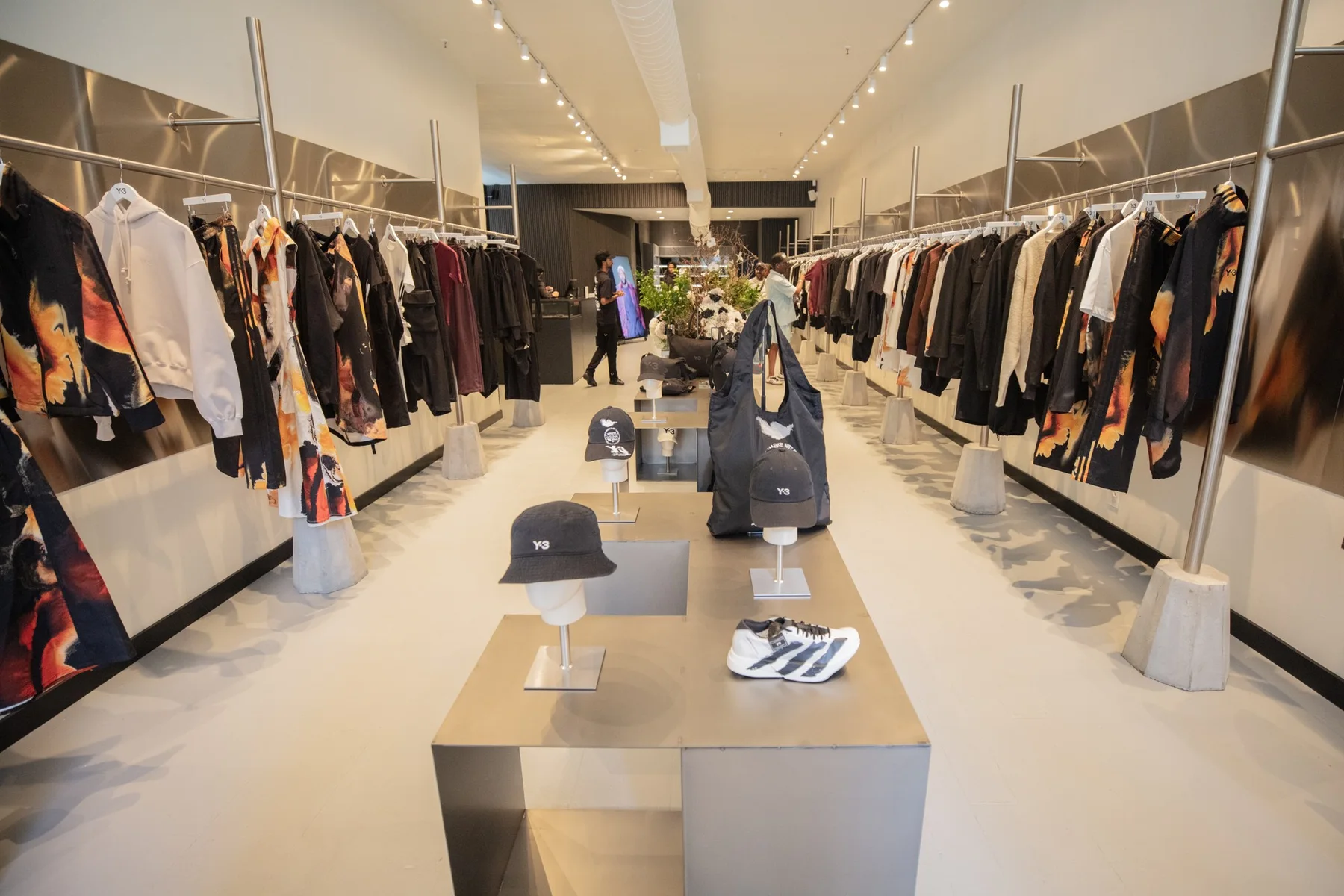 The completed Y-3 SoHo store with apparel rails and sculptural product displays