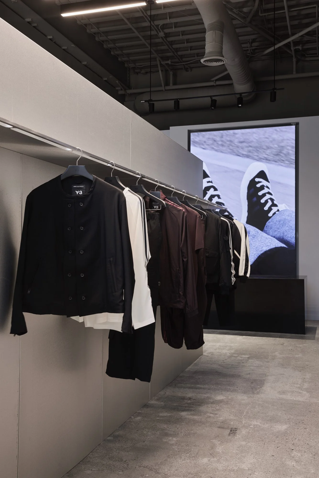Integrated apparel rail and digital campaign display at Y-3 West Hollywood