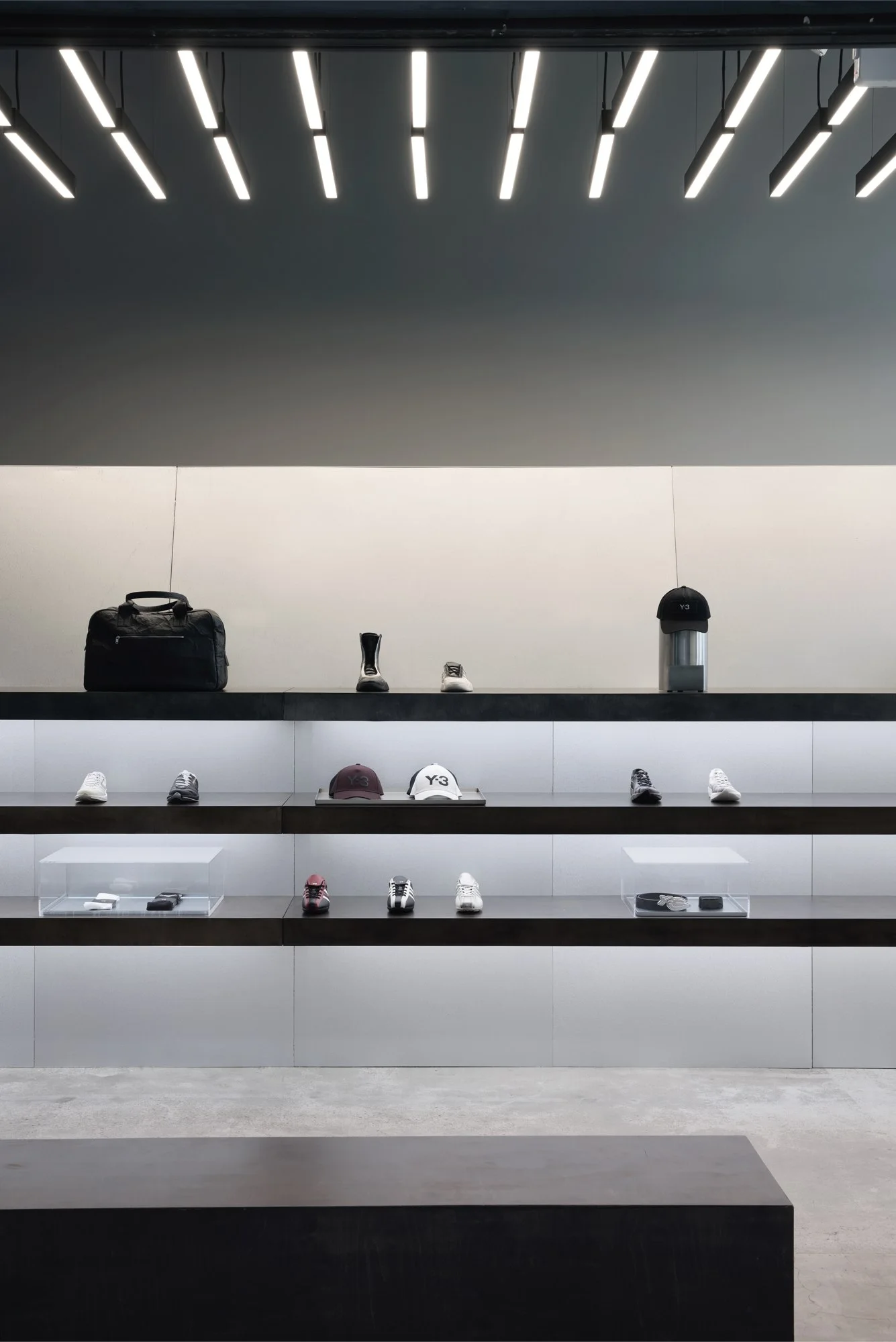 Illuminated product shelving and material details at Y-3 West Hollywood
